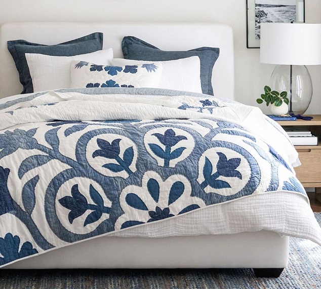 blue and white bed quilt