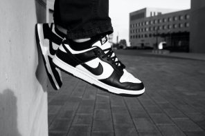 persons feet hanging with nike dunks
