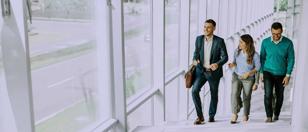 two men and a woman wearing business attire