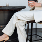 woman wearing white elegant pants